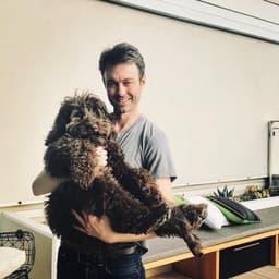 Founder holding Ned as a puppy